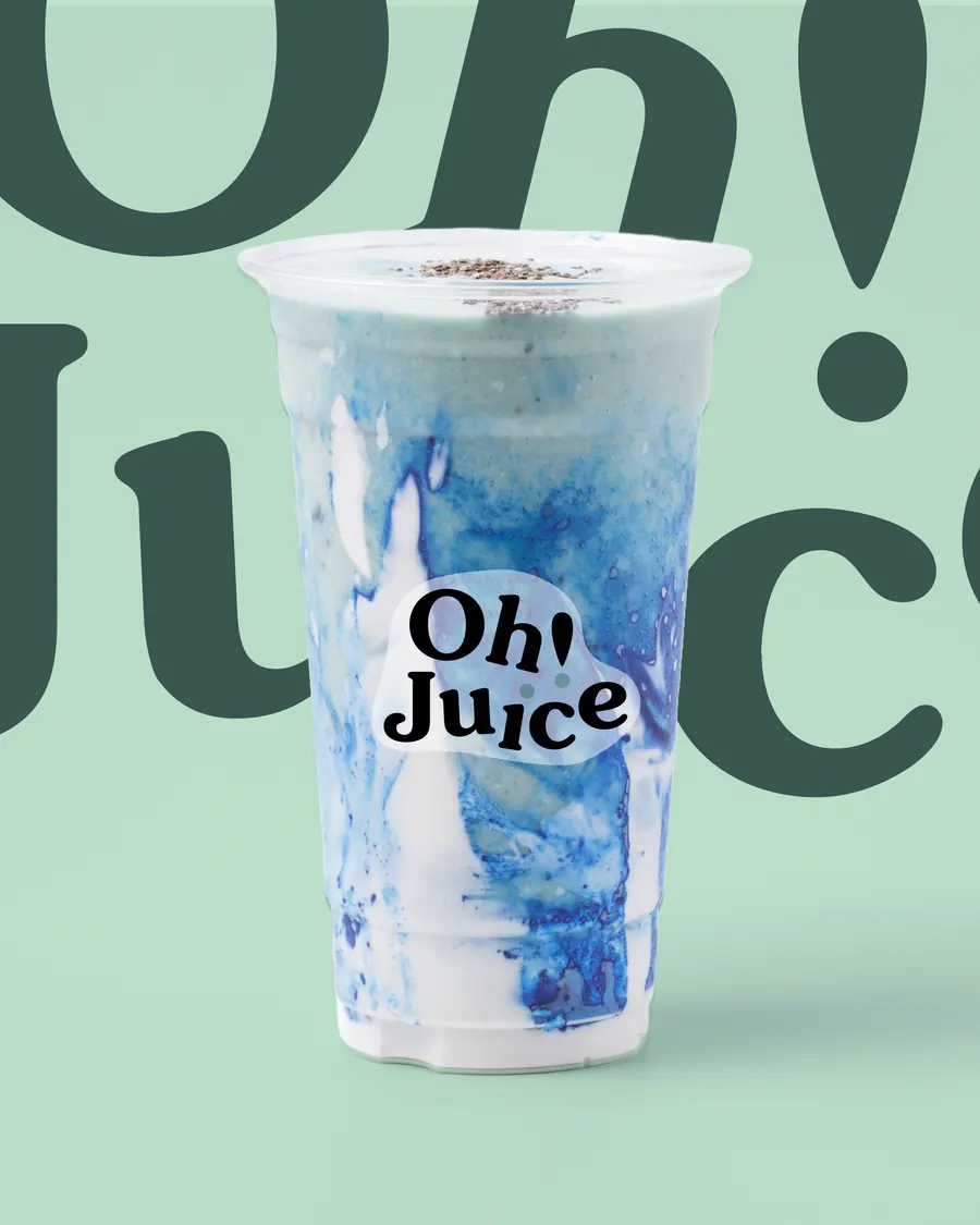 A blue swirl smoothie in an Oh! Juice cup, in front of the giant wordmark on mint green.