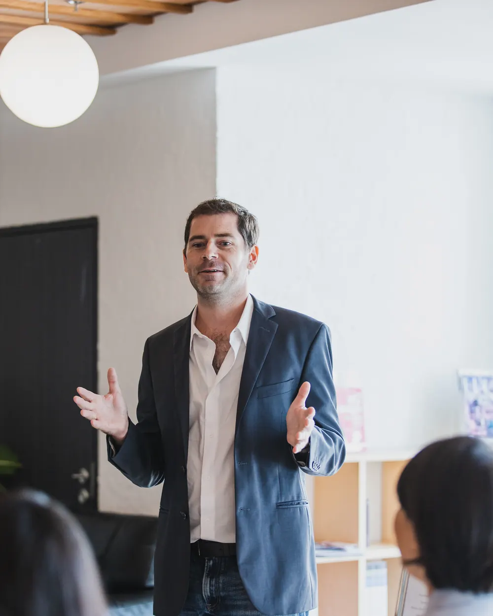Sébastien speaking to guests at a roundtable in the Jacob Jensen Design studio in Bangkok.