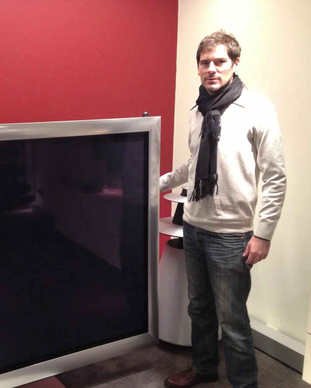 Sébastien in Denmark in 2012, standing next to a large Bang & Olufsen television.